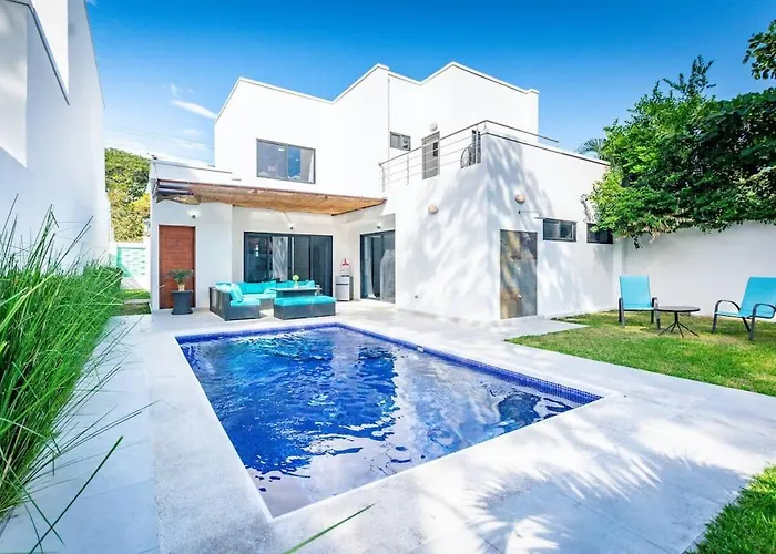 Ultramodern Townhome With An Inviting Coastal Design And Lush Outdoor Oasis With A Private Pool