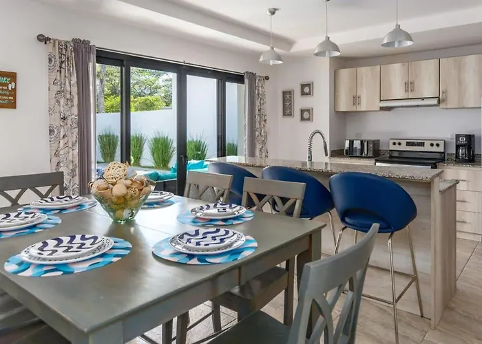 Ultramodern Townhome With An Inviting Coastal Design And Lush Outdoor Oasis With A Private Pool *