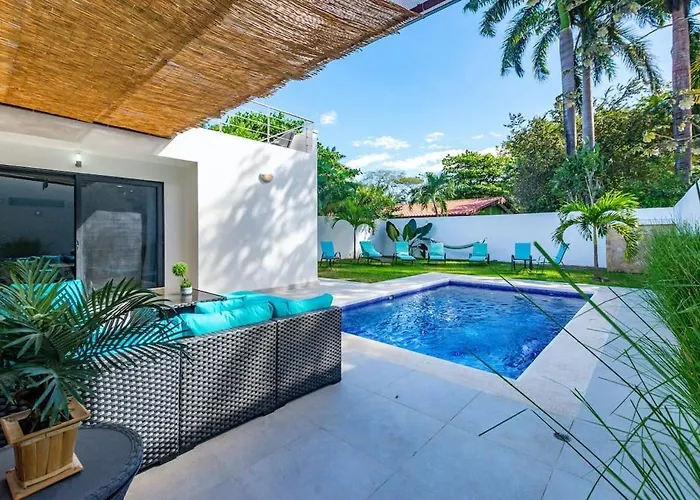 Holiday home Ultramodern Townhome With An Inviting Coastal Design And Lush Outdoor Oasis With A Private Pool