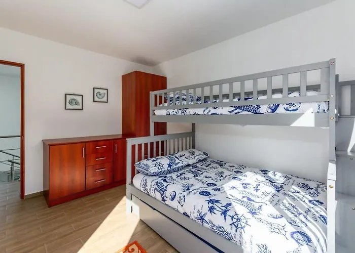 Ultramodern Townhome With An Inviting Coastal Design And Lush Outdoor Oasis With A Private Pool
